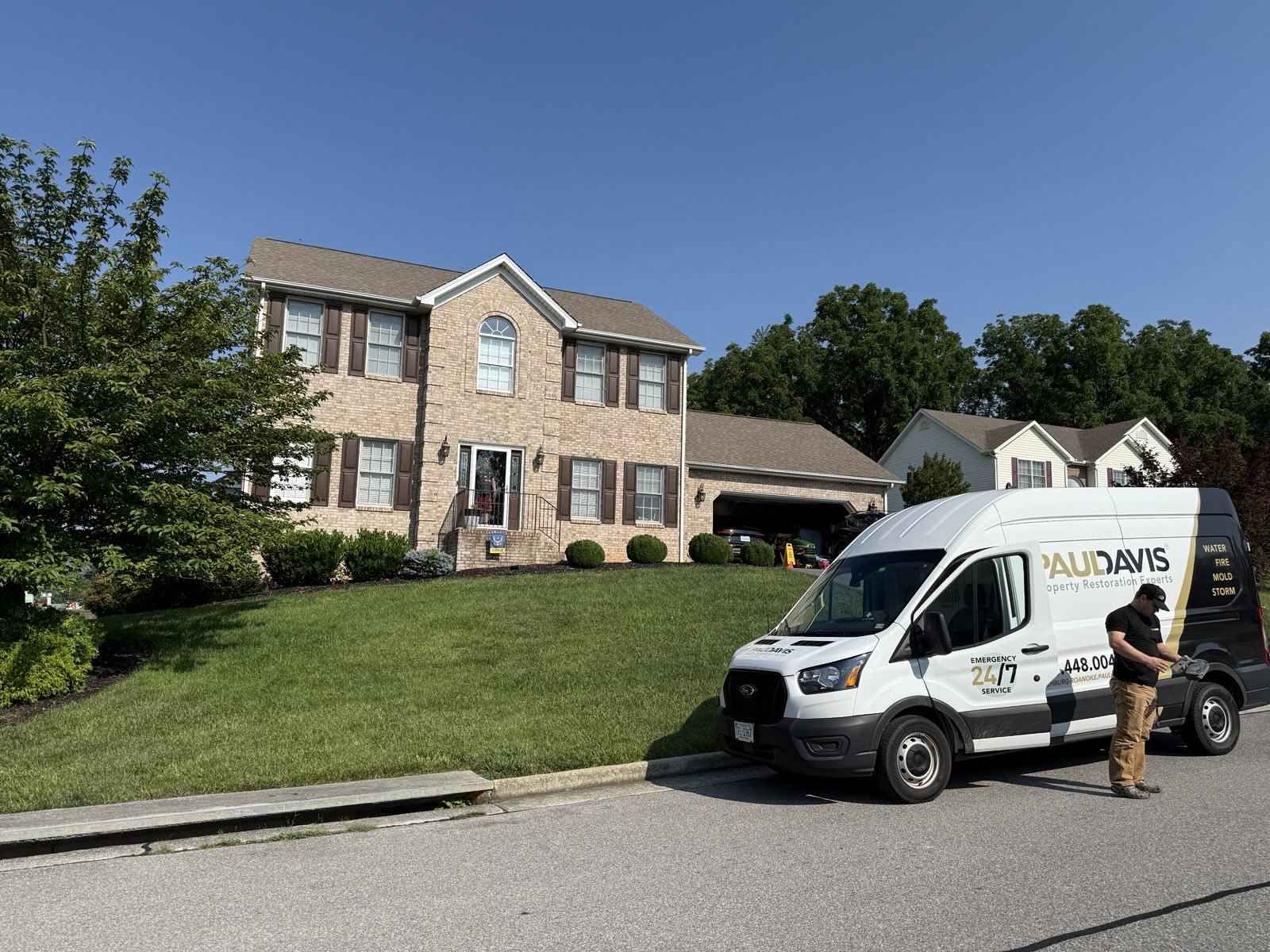 Paul Davis Restoration service van parked outside residential home in Lynchburg, Roanoke and Southside VA